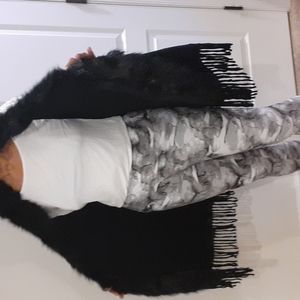 Black sweater vest with with fur. Not sure brand name, tag is missing
